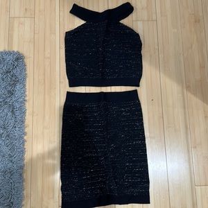 Two piece Black/silver crop top and skirt. Worn once. Stretch. Bebe size small.